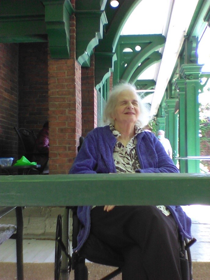 Photo of Sharon Holcroft sitting outside of the Fulford Residence